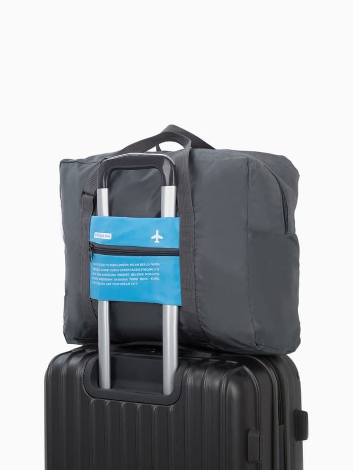 Сумка дорожная на молнии, складная в косметичку, наружный карман, держатель для чемодана, серая, голубая