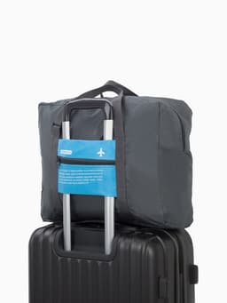 Сумка дорожная на молнии, складная в косметичку, наружный карман, держатель для чемодана, серая, голубая