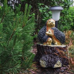 Садовая фигура - фонарь из полистоуна «Три ежа на пне», 27×26×34 см