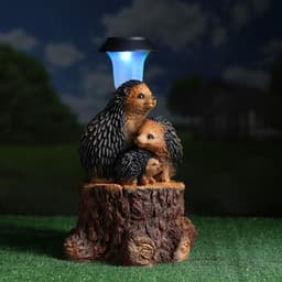 Садовая фигура - фонарь из полистоуна «Три ежа на пне», 27×26×34 см