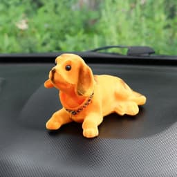 Игрушка на панель автомобиля «Собака качающая головой» рыжая