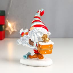 Фигурка полистоун «Дедушка Мороз с подарком, в полосатом колпаке», 13x5.5x10.5 см