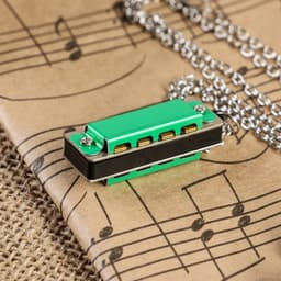 Губная гармошка Music Life 4 отверстия, 8 тонов, 3.5×1.5×1 см, цепь 28 см, зеленая