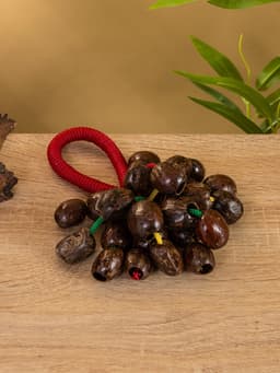 Сувенирный музыкальный инструмент «Погремушка», 16×10×3 см, орех кемири, МИКС