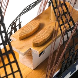 Сувенирная модель корабля «Рион», борта сине-чёрные, паруса бежевые с полосами, 50×44×10 см