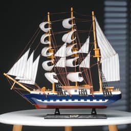 Сувенирная модель корабля «Рион», борта сине-чёрные, паруса бежевые с полосами, 50×44×10 см